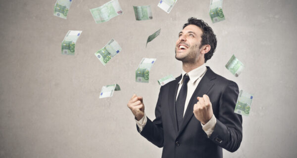 Businessman,Rejoicing,For,His,Success,With,Hundred-euro,Banknotes,Flying,In